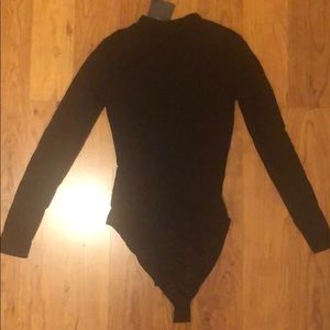 Black body suit. Never worn. Bought too small.